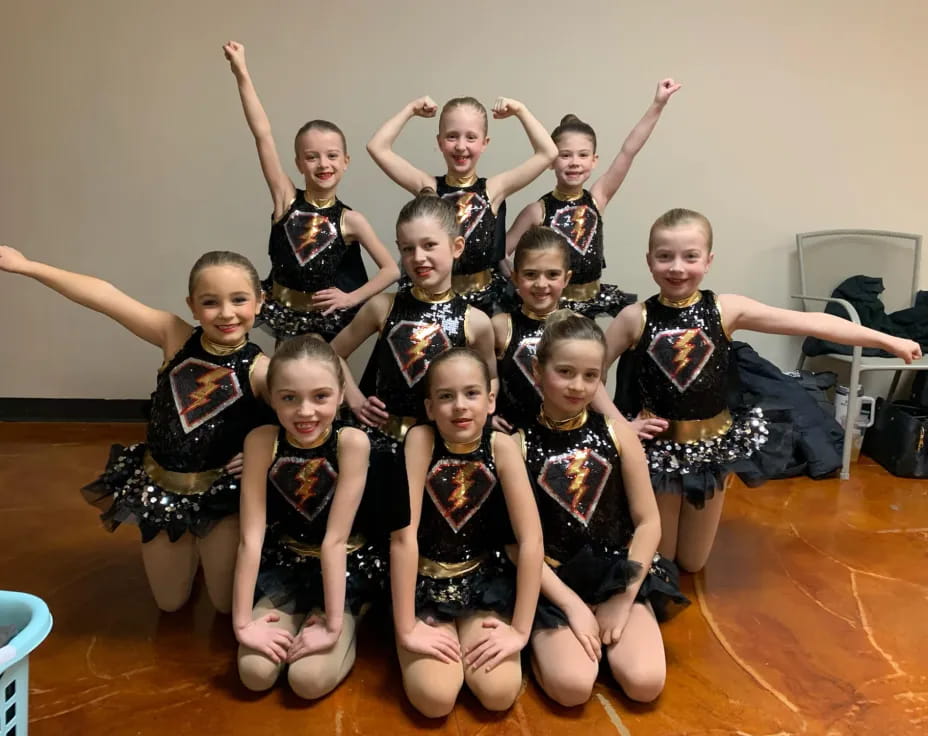 a group of girls posing for a photo