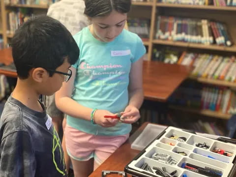 a few children looking at a book