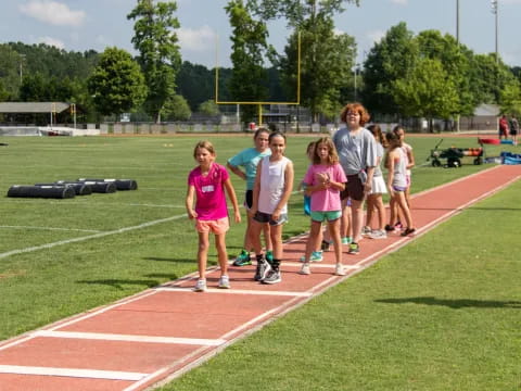 a group of children on a track