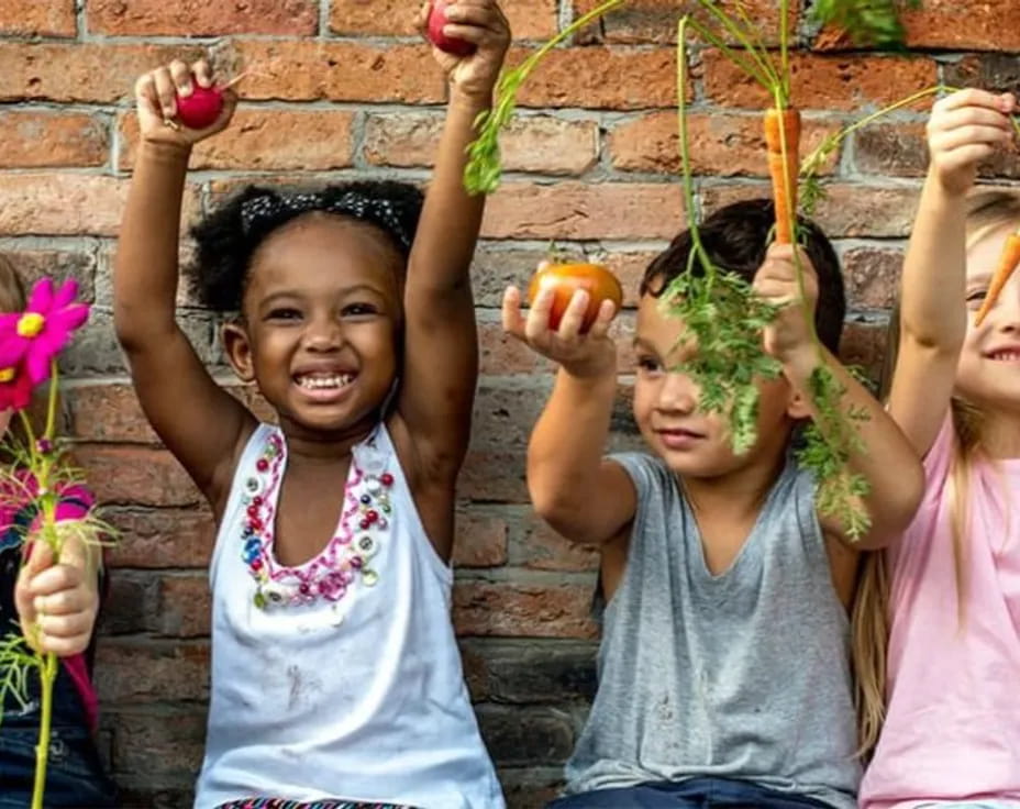 a group of children holding flowers
