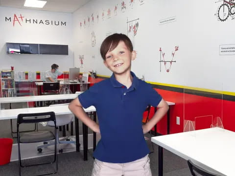 a boy standing in a room