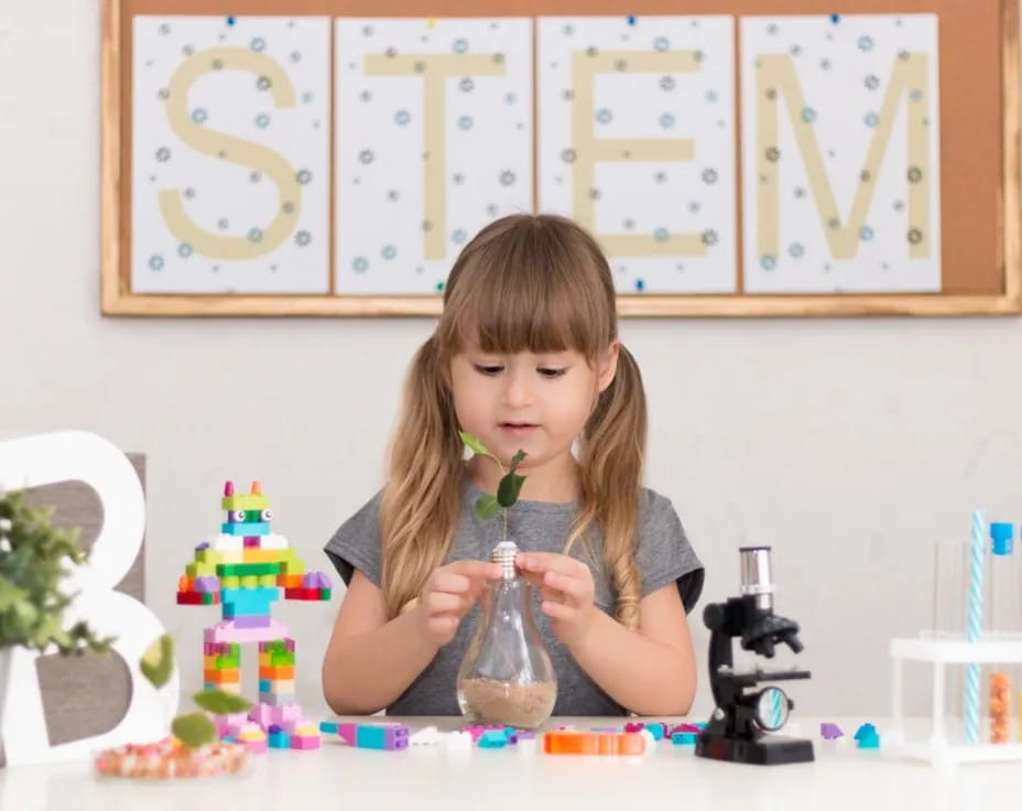 a girl holding a bottle