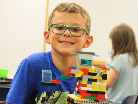 a boy wearing glasses
