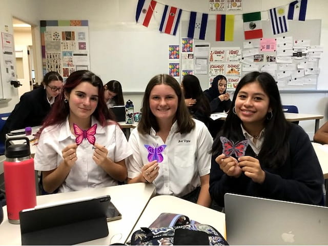 a group of women sitting at a table