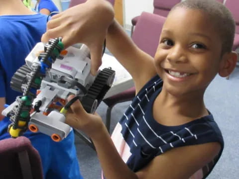 a child holding a toy