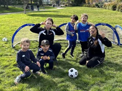 a group of kids posing for a picture