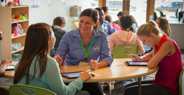 a group of people sitting at a table