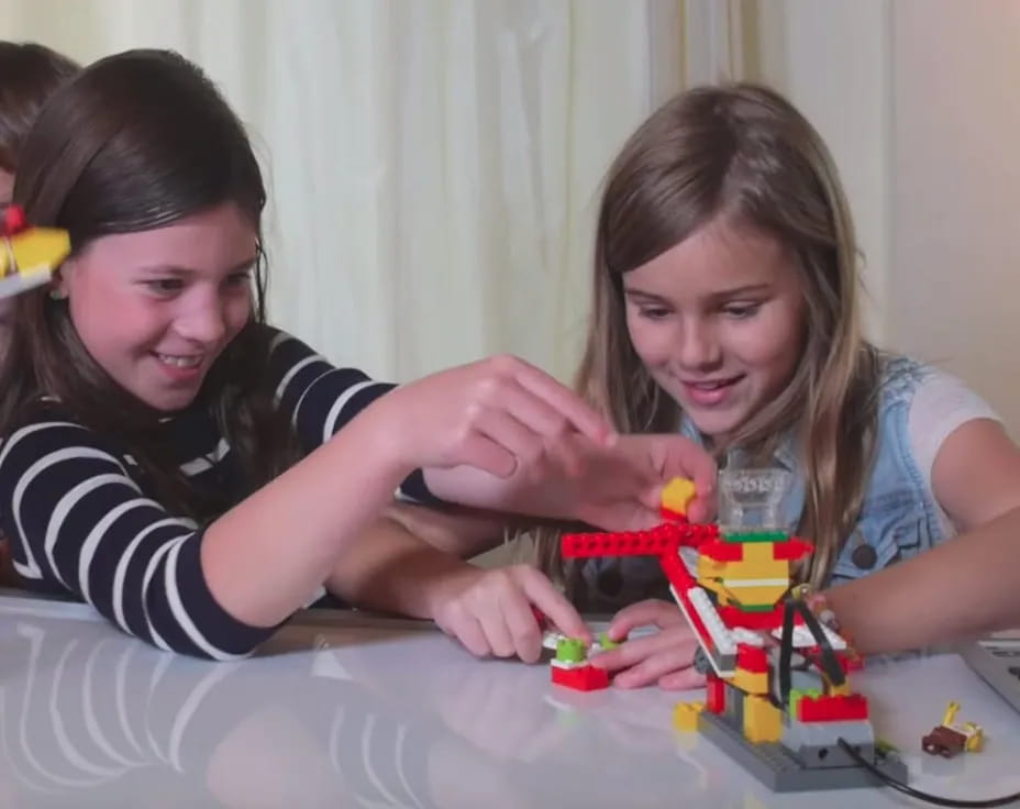 a group of girls playing with toys
