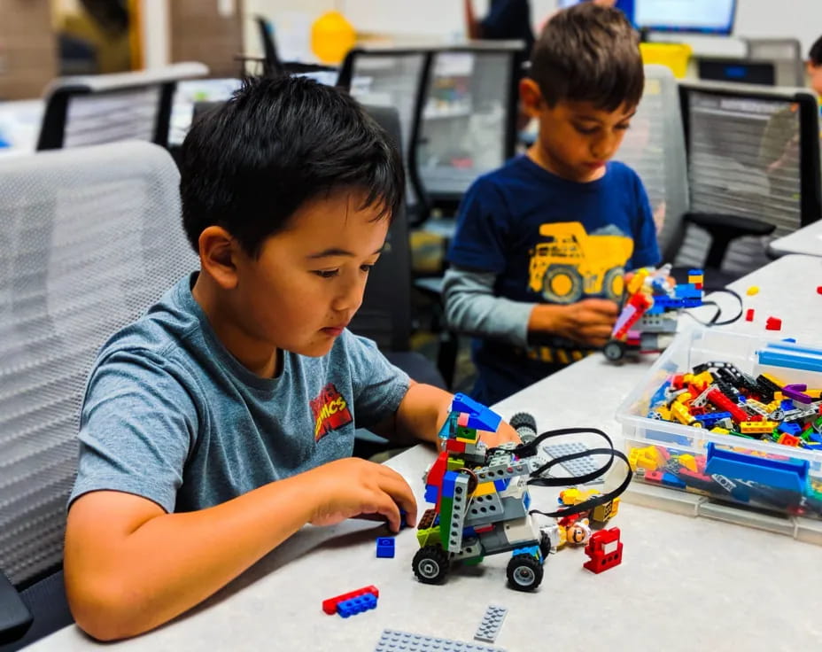 a couple of boys playing with toys