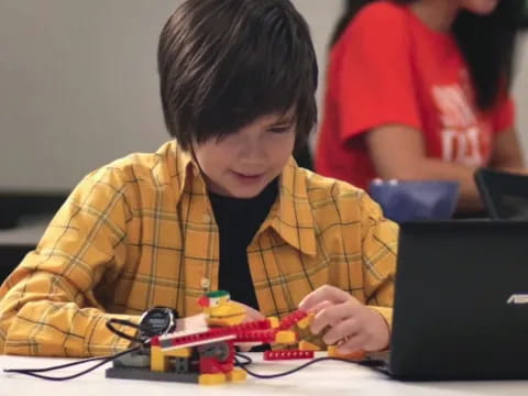 a boy playing with a toy
