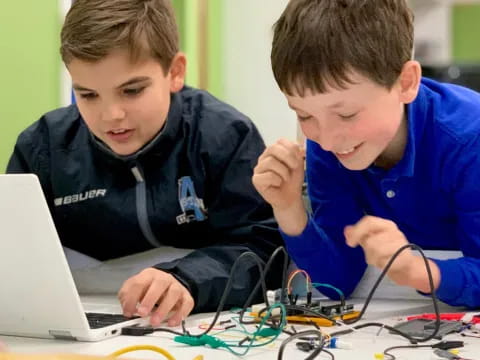 boys looking at a laptop