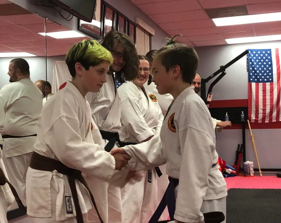 a group of people in white uniforms