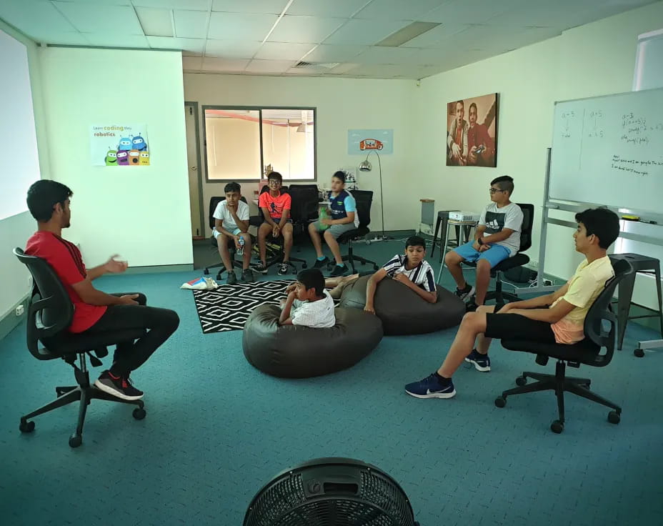 a group of people sitting in chairs