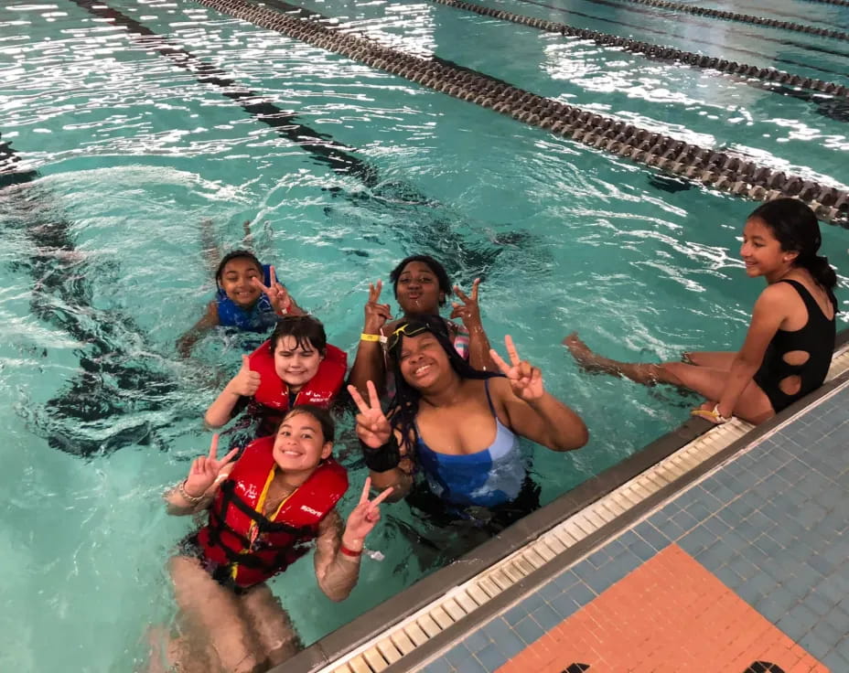 a group of people in a pool