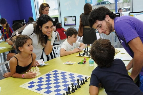 a group of people playing chess