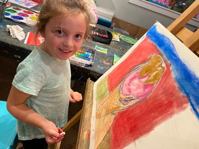 a young girl painting