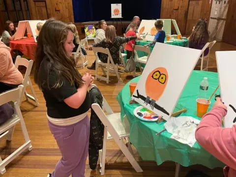 a girl painting a picture