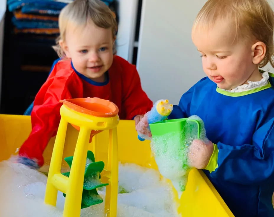 two children playing with toys
