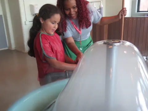 a person and a girl in a room