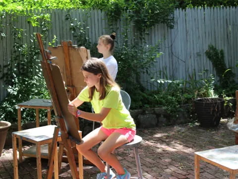 a group of people sitting outside
