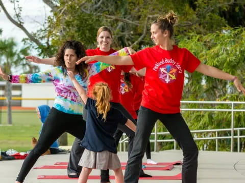 a group of women doing yoga