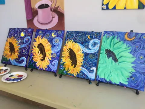 a group of paintings on a table