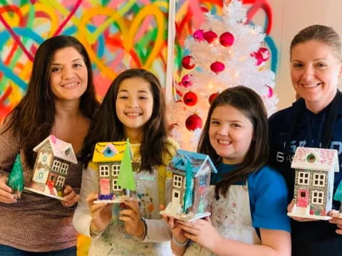 a group of people holding boxes