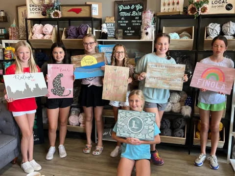 a group of children holding signs