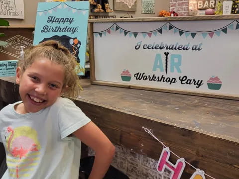 a young girl smiling