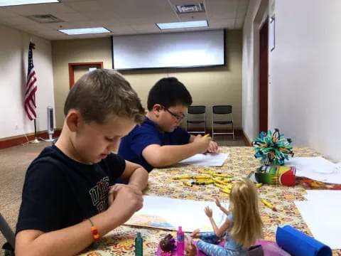 a group of people sitting around a table