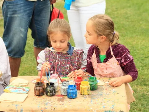 a couple of young girls painting