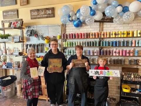 a group of people holding a sign