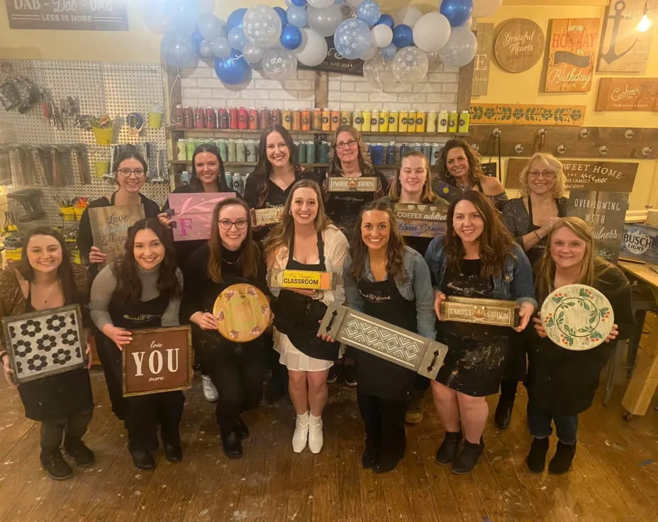 a group of women holding signs