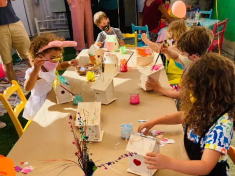 a group of children painting