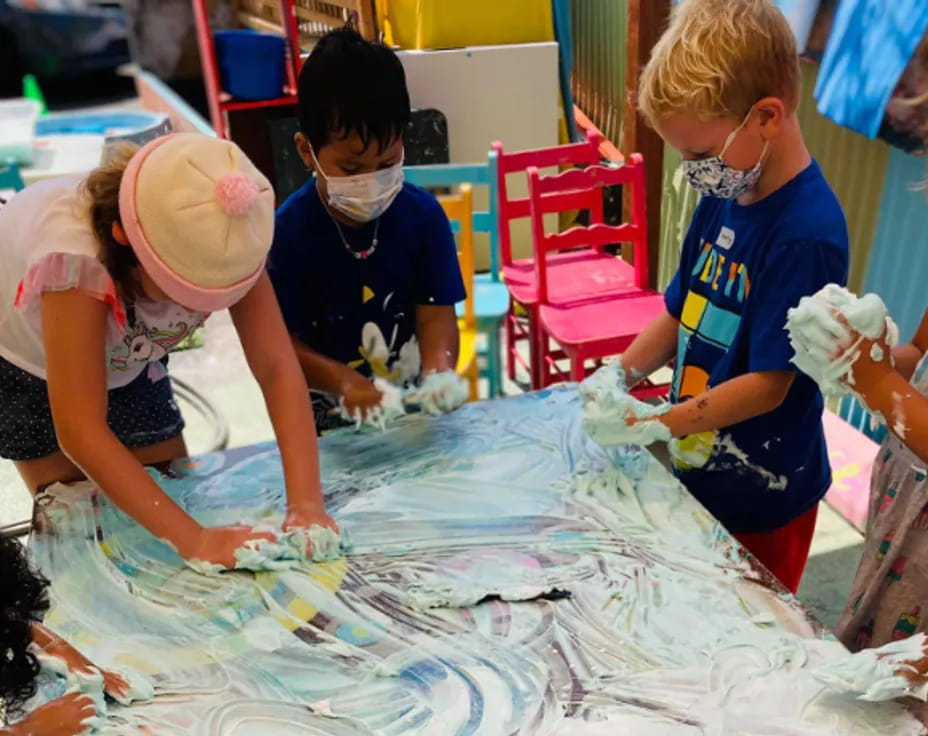 a group of children wearing masks