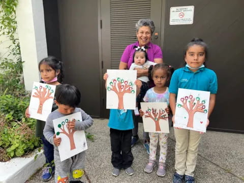 a group of children holding signs