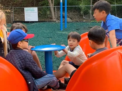 a group of kids playing in a play area
