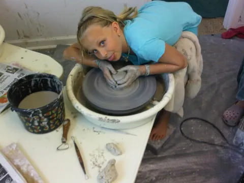 a person is making a pot