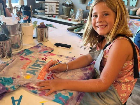 a woman sitting at a table