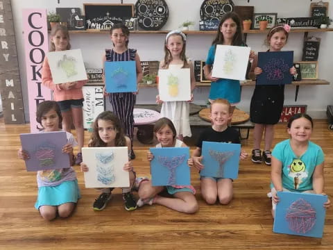 a group of children holding books