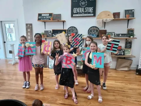 a group of children holding skis