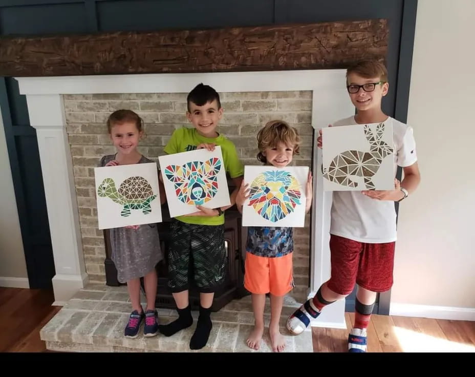 a group of kids holding up signs