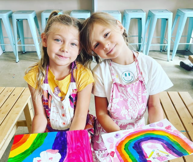 two girls sitting at a table