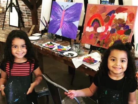 two girls sitting at a table