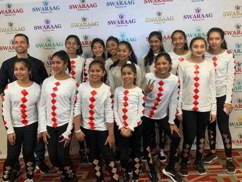 a group of people wearing medals