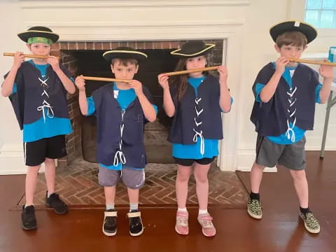 a group of kids wearing clothing