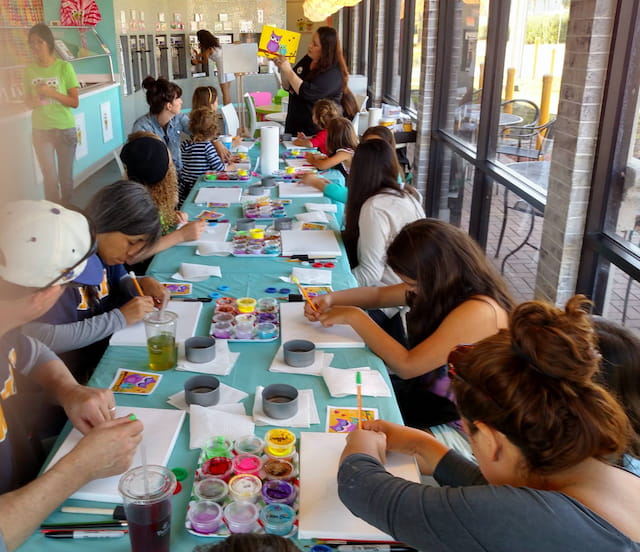a group of people sitting around a table