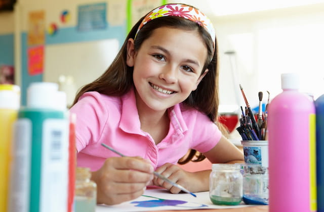 a young girl smiling