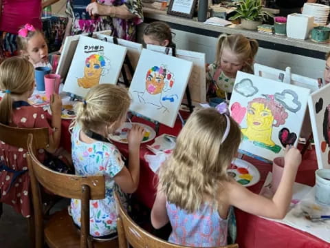 a group of children painting