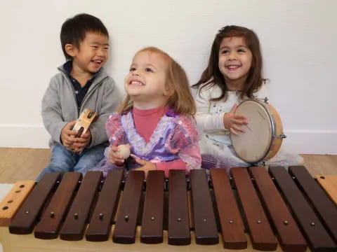 a group of children playing drums